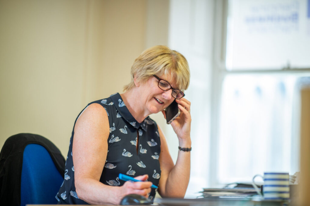 Lynn Bradley taking a client call