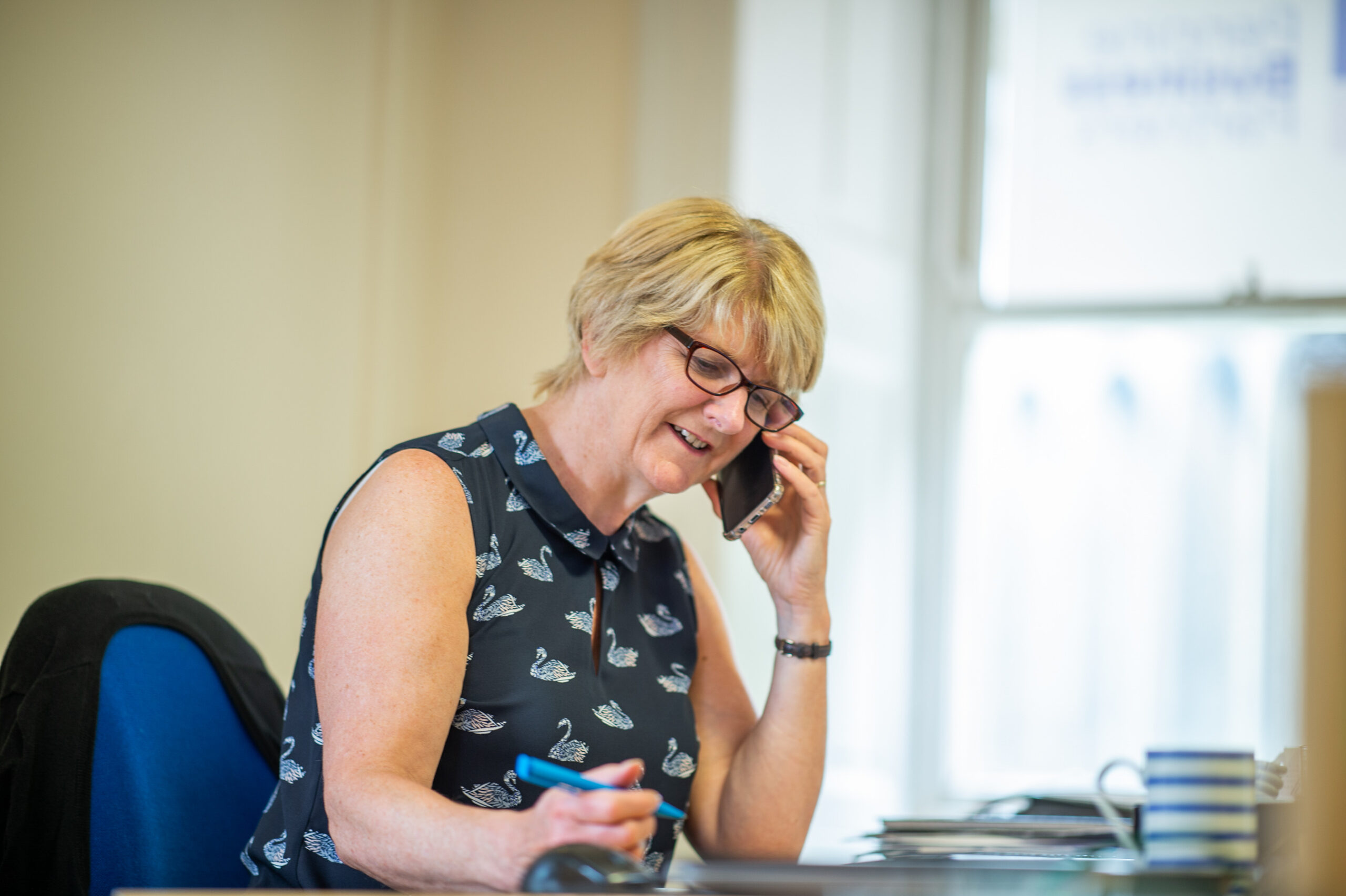 Lynn Bradley taking a client call